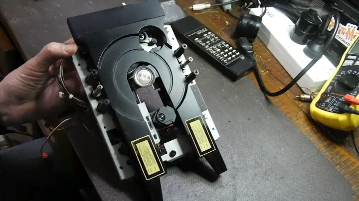 Laser mechanism re-assembly following a service - Teac VRDS T-1 Transport is used as an example.